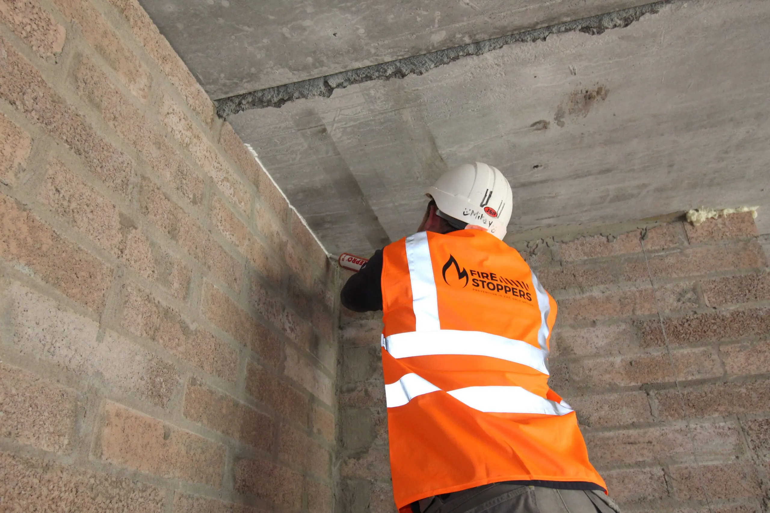 A Firestopper doing a fire safety inspection | Reach out to know more about us