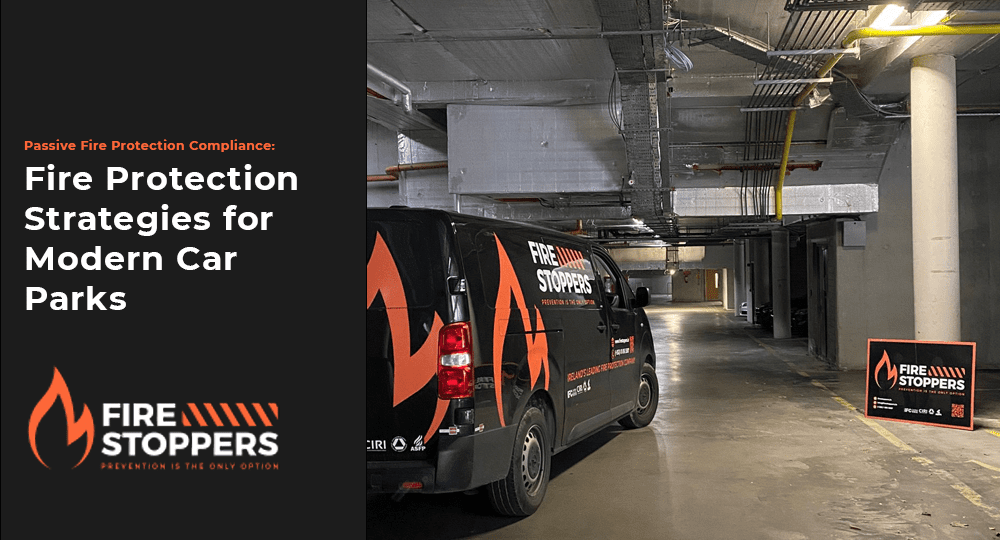 A branded black service van parked inside a concrete underground parking garage, with exposed overhead piping and a Fire Stoppers sign on the ground.