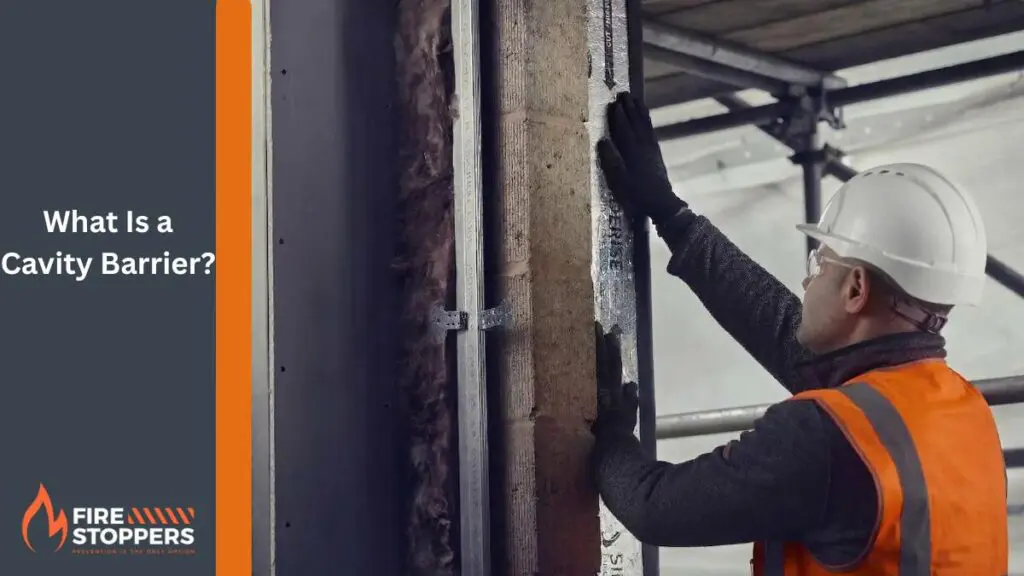 fire safety worker in an orange vest and white helmet surveying a cavity barrier | Fire Stoppers