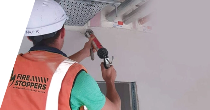 image of a man installing intumescent paint on a commercial office block in ireland